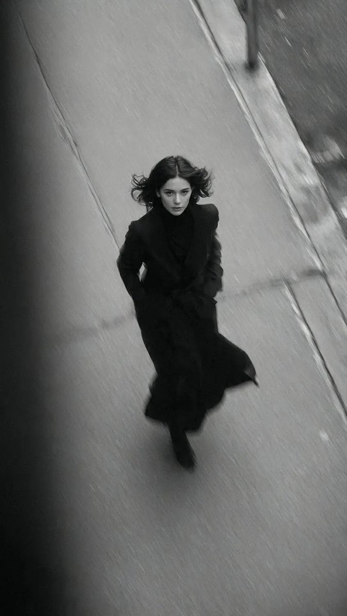 Cinematic Black & White Fashion: Woman in Long Black Coat Nano Banana提示词