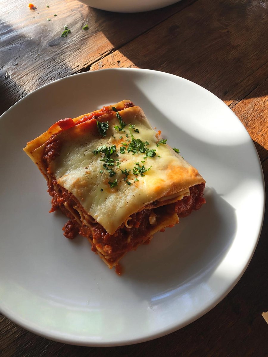 Delicious Lasagna Slice on White Plate - Food Photography Nano Banana提示词