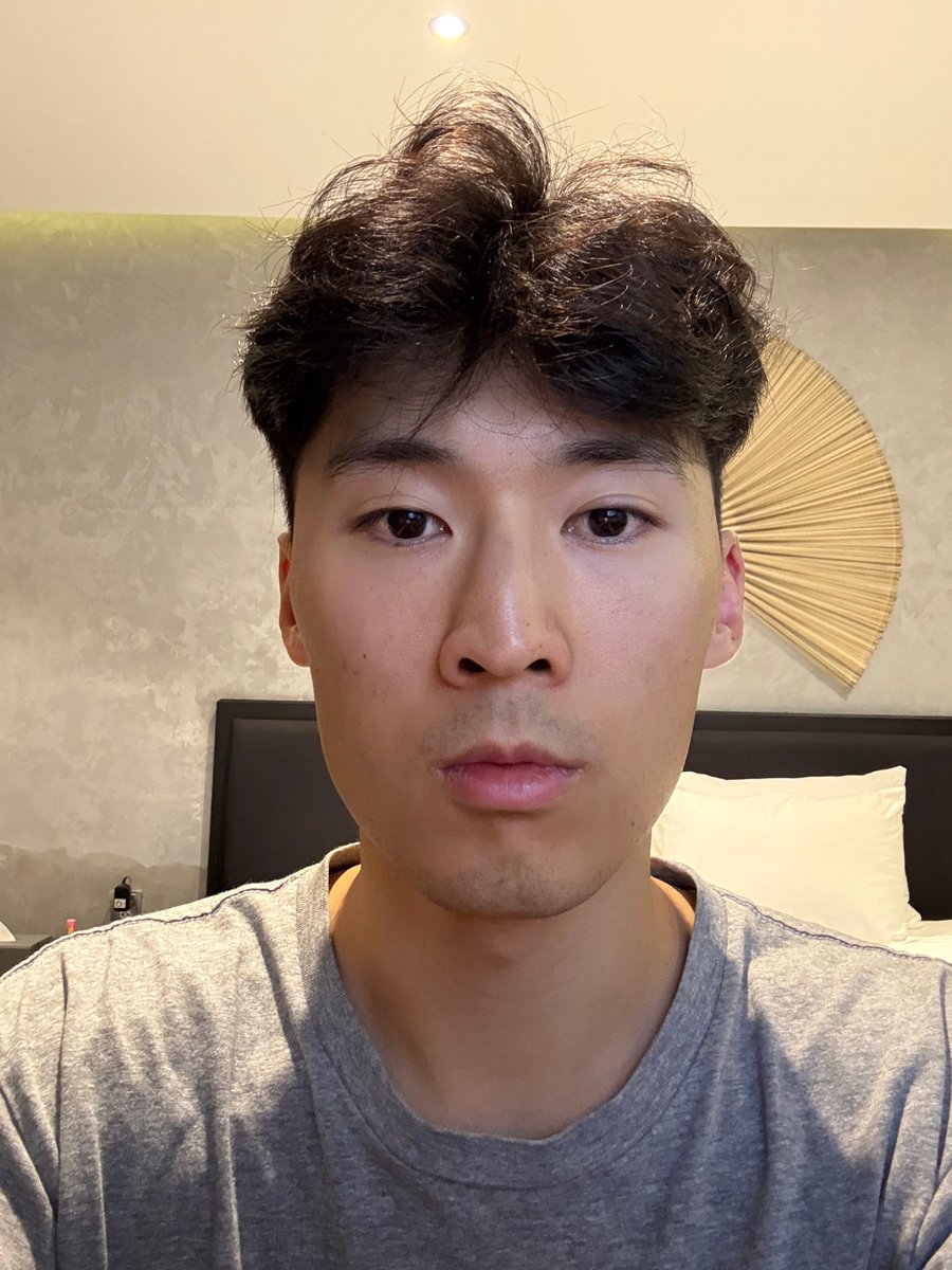 Photorealistic Portrait of Young Man with Short Hair Nano Banana提示词